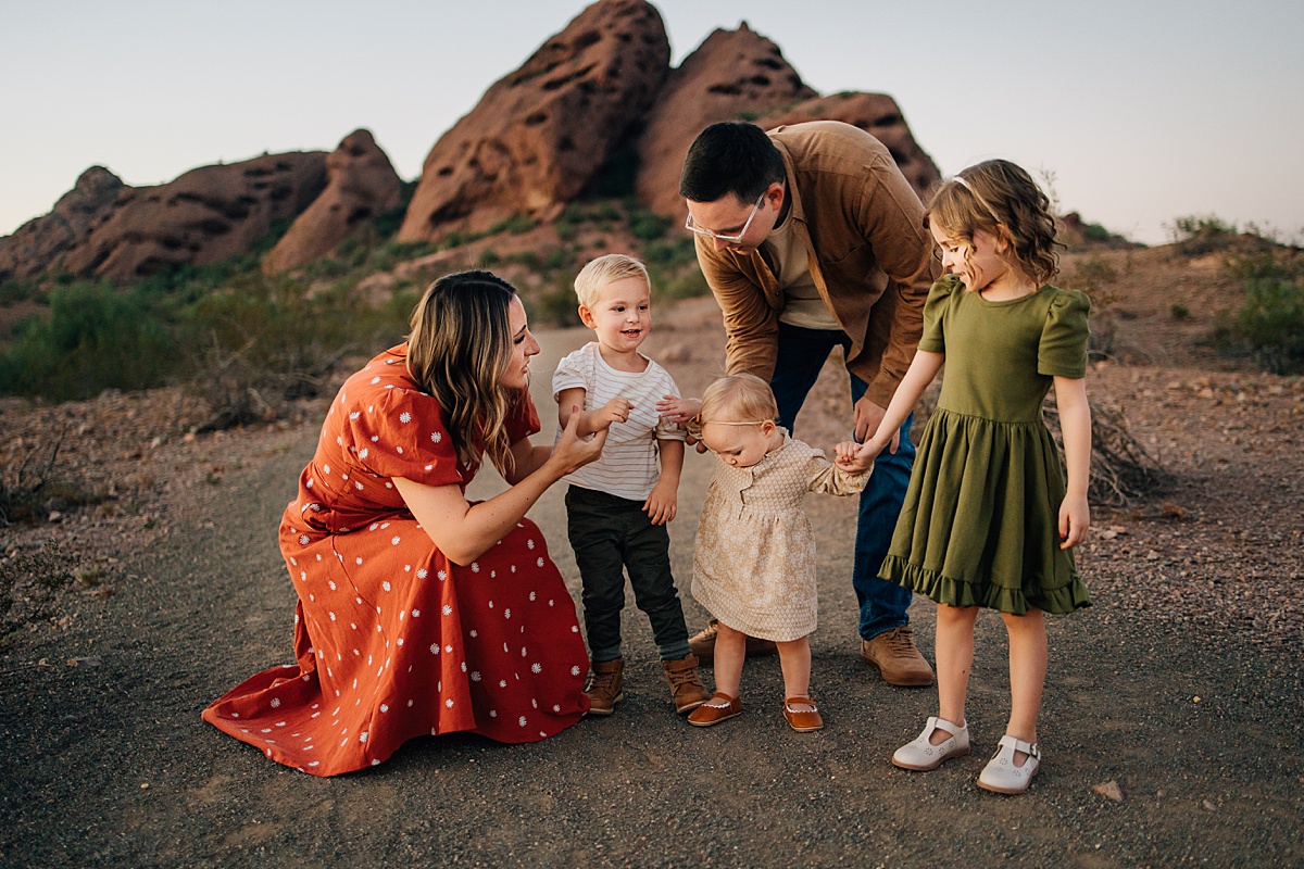 Candid family portrait at Papago Park red rocks by Tempe AZ Family Photographer