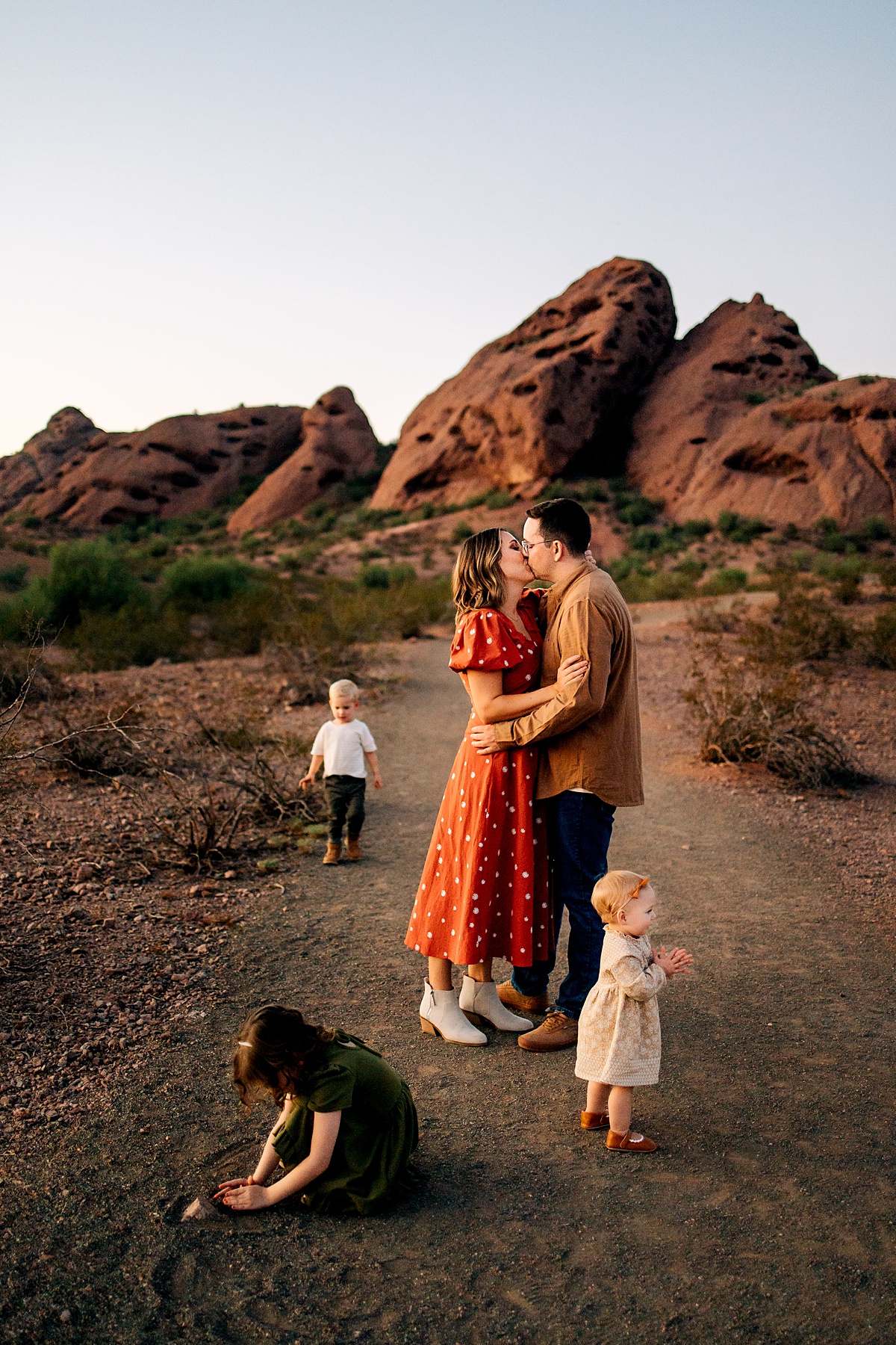 Candid family portrait at Papago Park red rocks by Tempe AZ Family Photographer