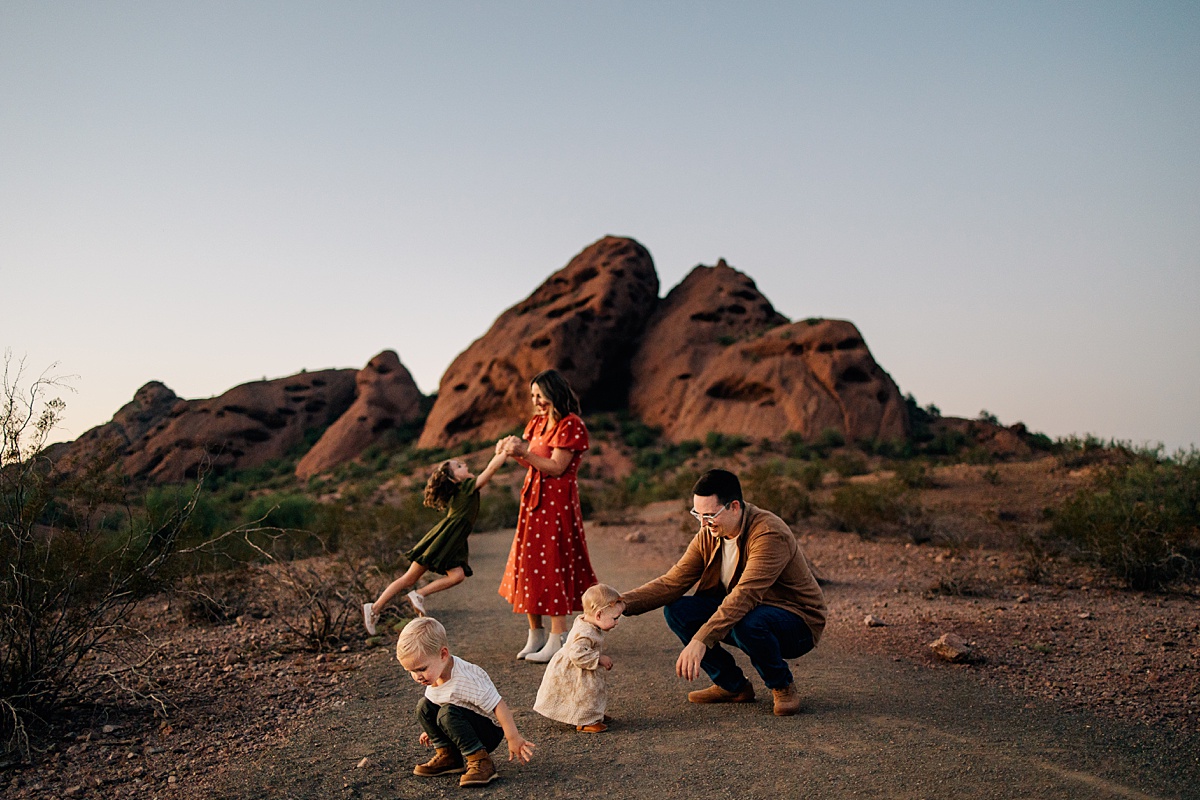 Candid family portrait at Papago Park red rocks by Tempe AZ Family Photographer